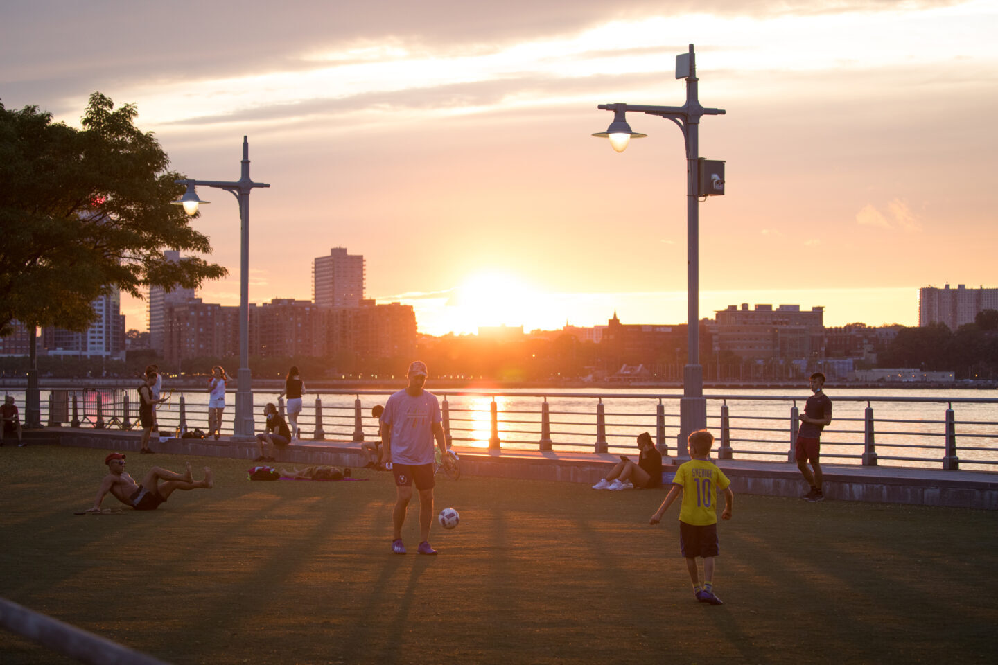 Sunset at Pier 46 as soccer players practice on the field