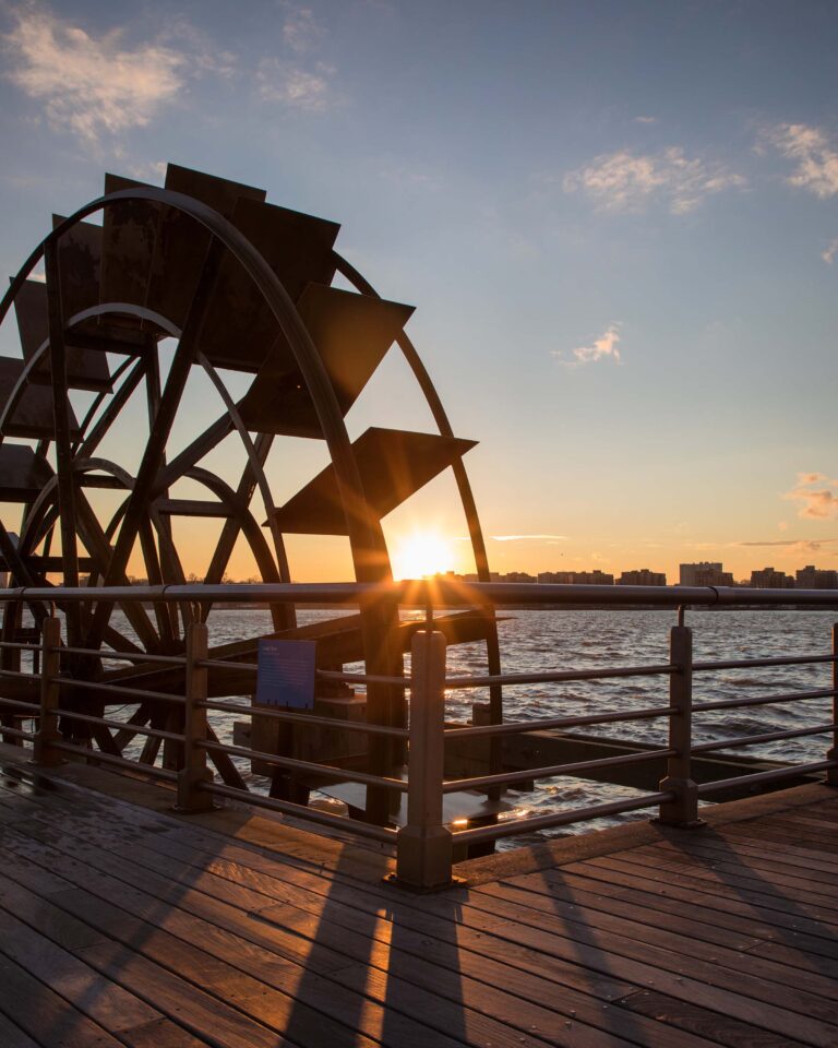 A close up of the water wheel at Pier 66 as the sun sets