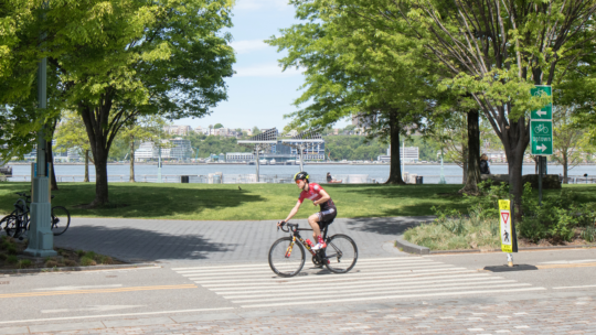 A cyclist continues down the bikeway