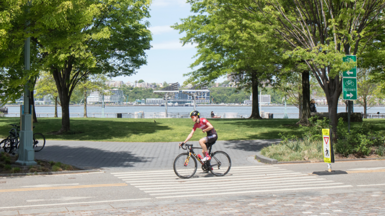 A cyclist continues down the bikeway