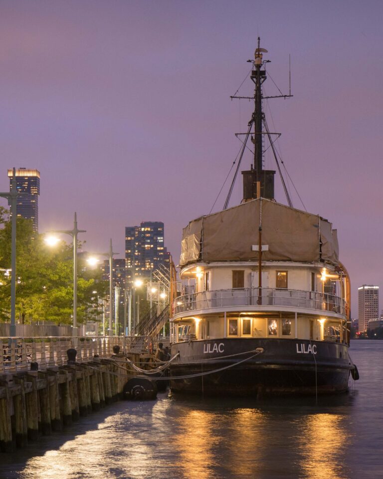 Night time with the historic vessel The Lilac lit up for the visitors