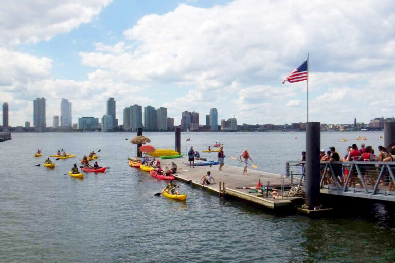 Kayakers launching from the Downtown Boathouse dock at Pier 26