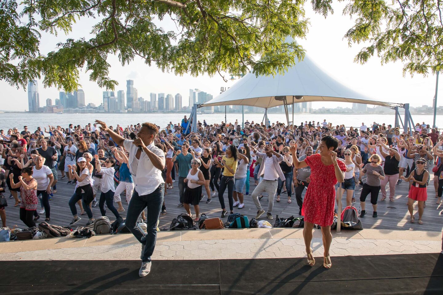 Talia teaches a group of Park visitors how to salsa at Pier 45