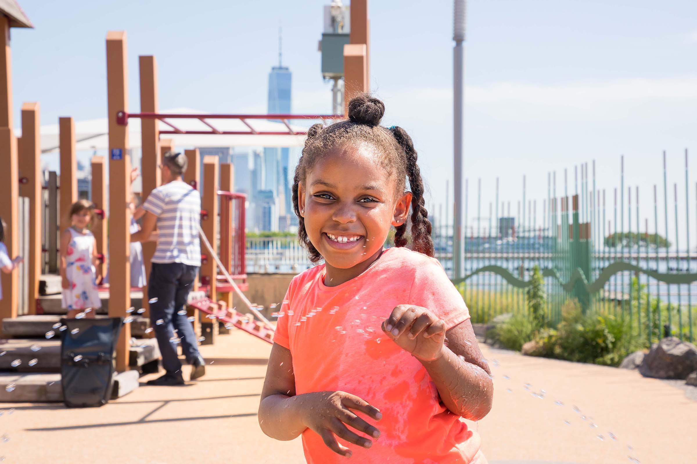A young girl enjoying bubbles at Pier 51's playground