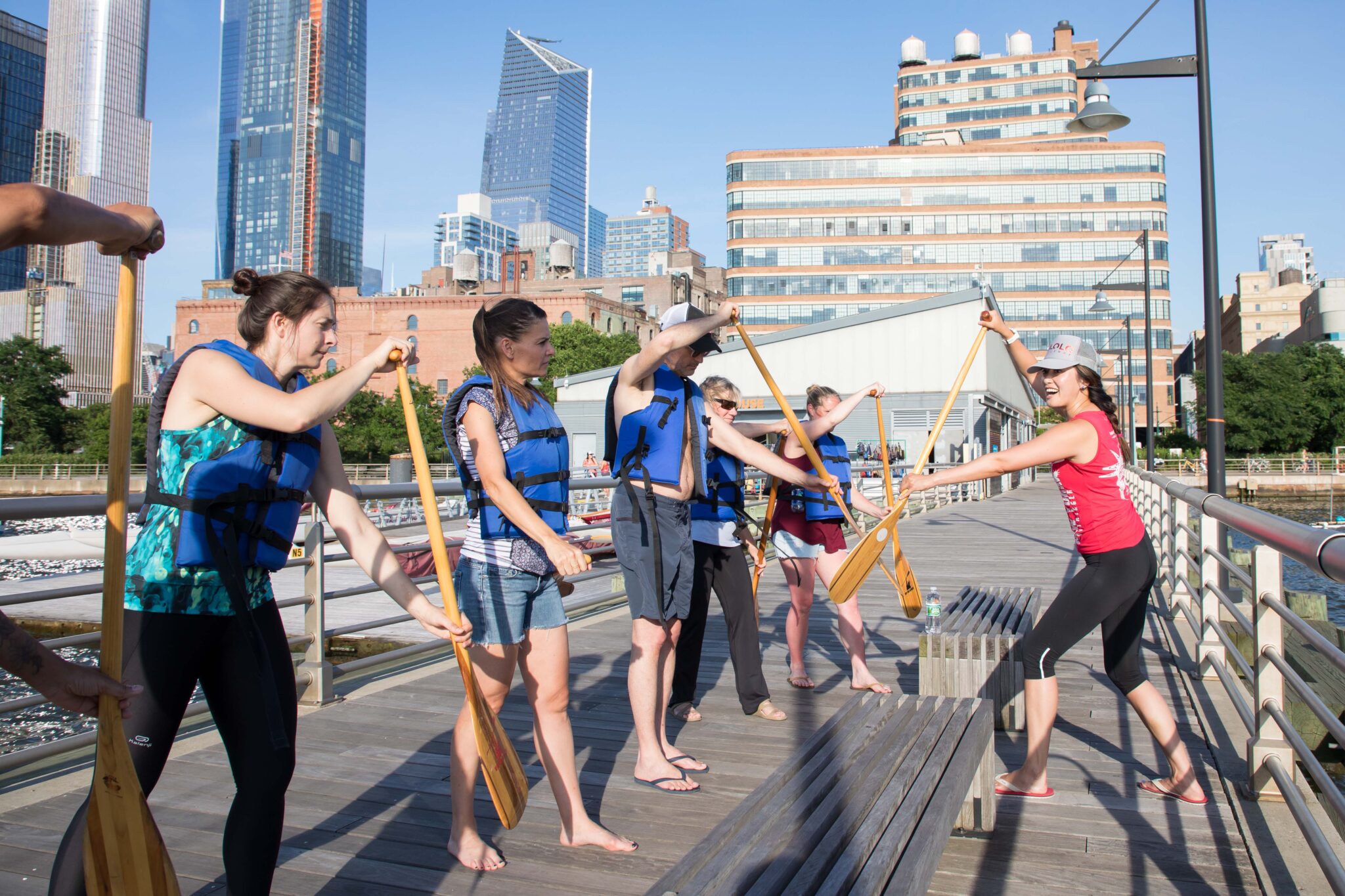 Members of Outrigger take classes on how to paddle their boat on the Hudson River