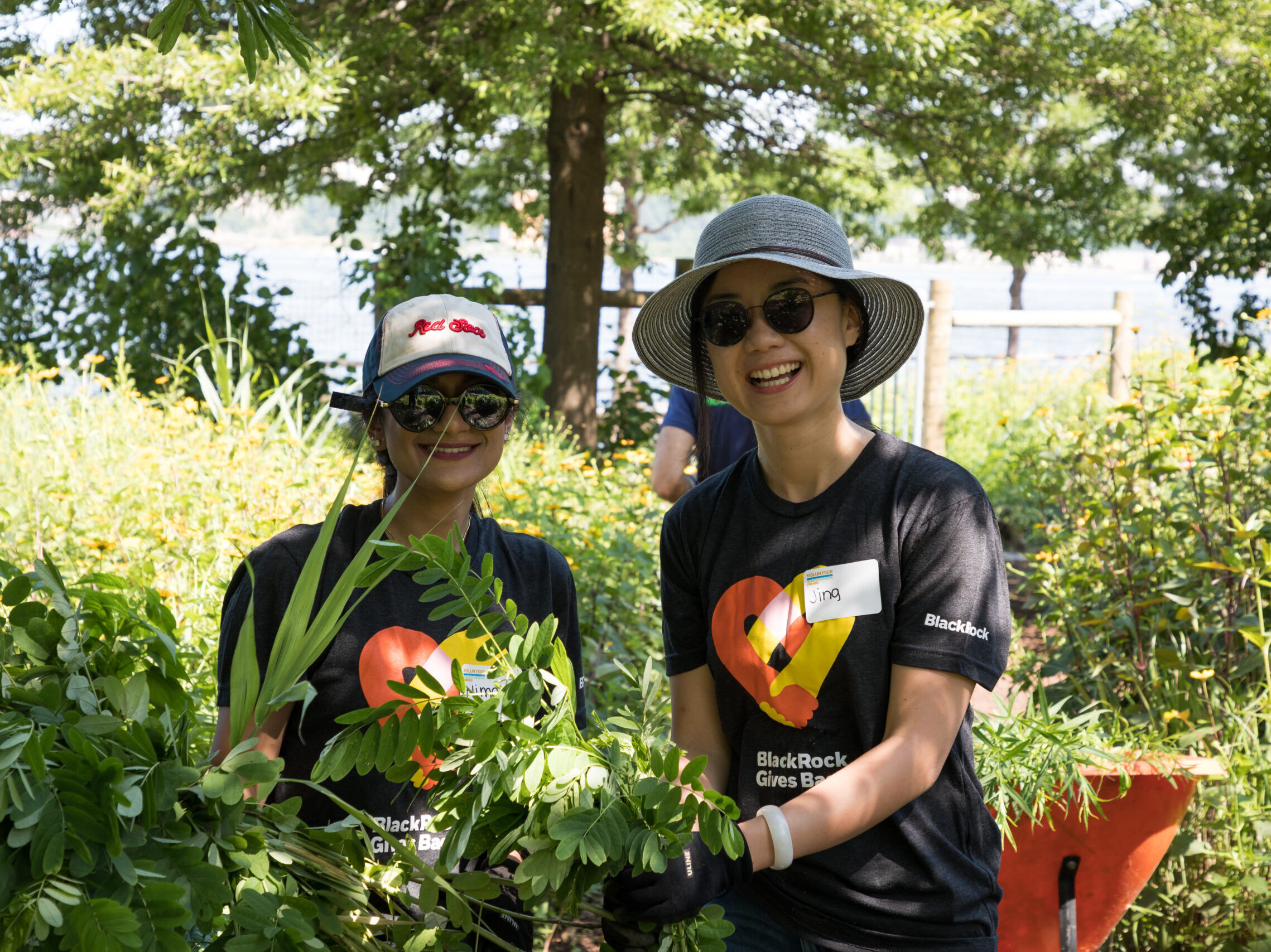 Two volunteer gardeners help at the community garden
