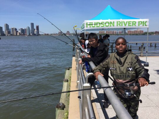 Kids enjoying fishing in the Hudson River