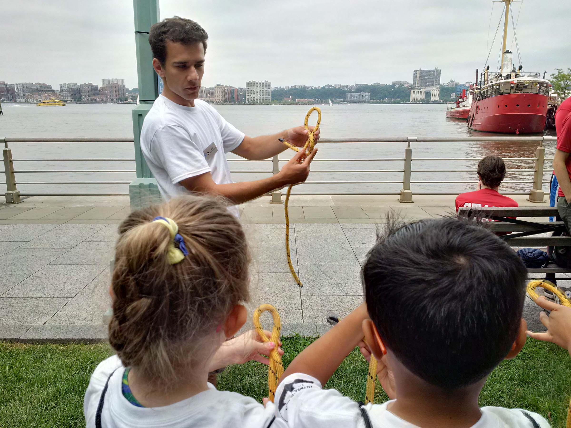 A Park educator teaches students how to tie knots