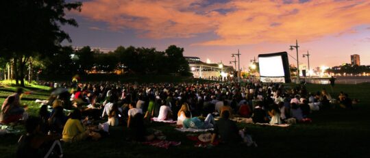 The large screen fills Pier 63 during Hudson Riverflicks in Hudson River Park
