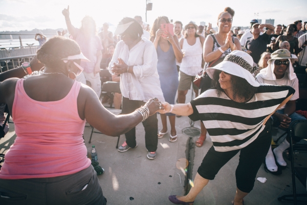 Park visitors turn on the heat and dance until the sun sets at Blues BBQ in Hudson River Park