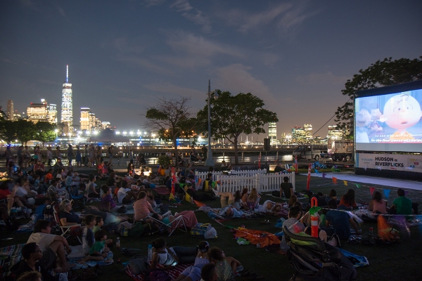 As the sun sets on the lawn at Pier 63, the audience attending Riverflicks awaits the film to start