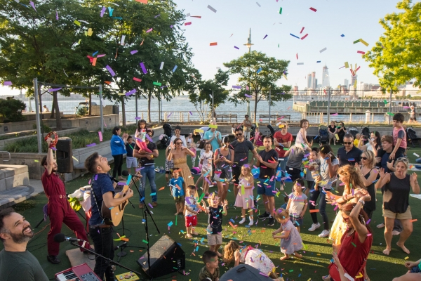 A group of musicians entertain a group of young kids during Summer of Fun in Hudson River Park