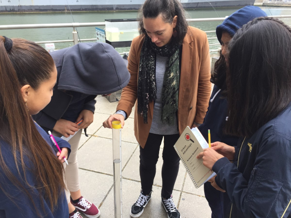 Students learn from staff from Columbia University on collecting data from the Hudson River