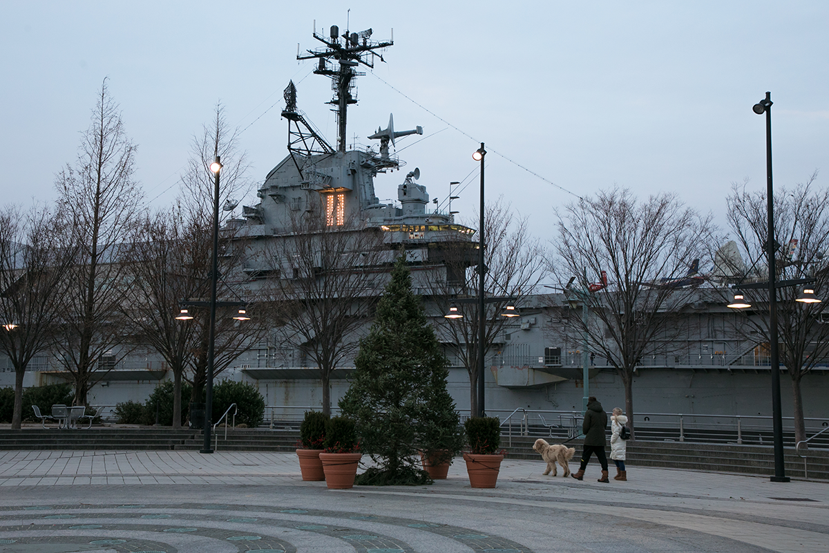 A pine tree lit up near The Intrepid Museum