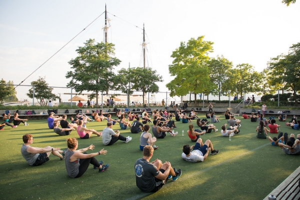 Fitness buff enjoy yoga on the lawn at PIer 25