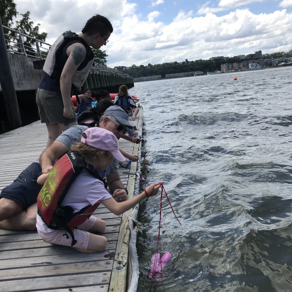 Eager Park visitors pull out microplastics to research and understand how dangerous plastics in the rivers are