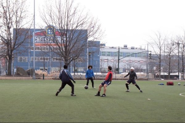 Soccer players play a chilly game during winter in Hudson River Park