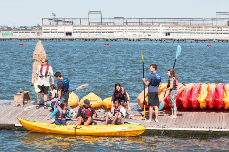 Kayakers at the Downtown Boathouse launch into the Hudson River