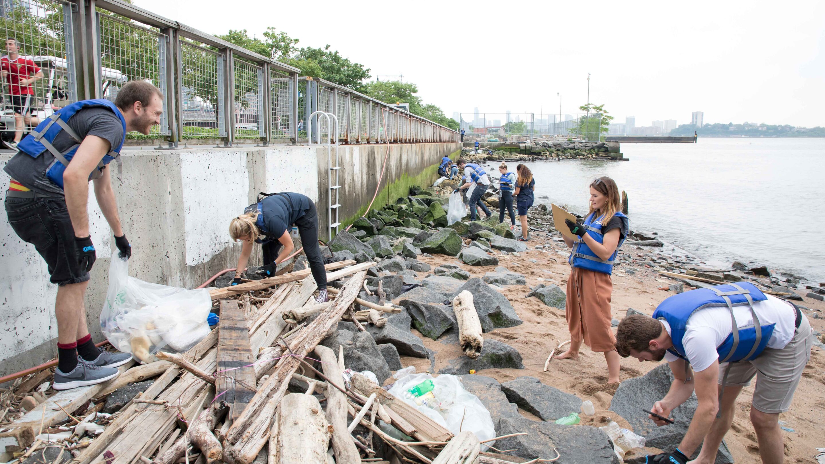A group of volunteers clean up the shoreline