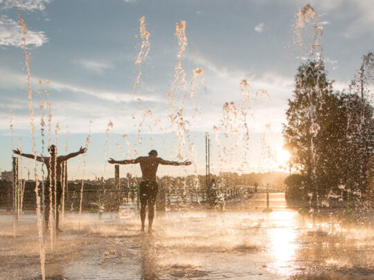 Two Park visitors enjoying the fountain area on Pier 84 at Hudson River Park