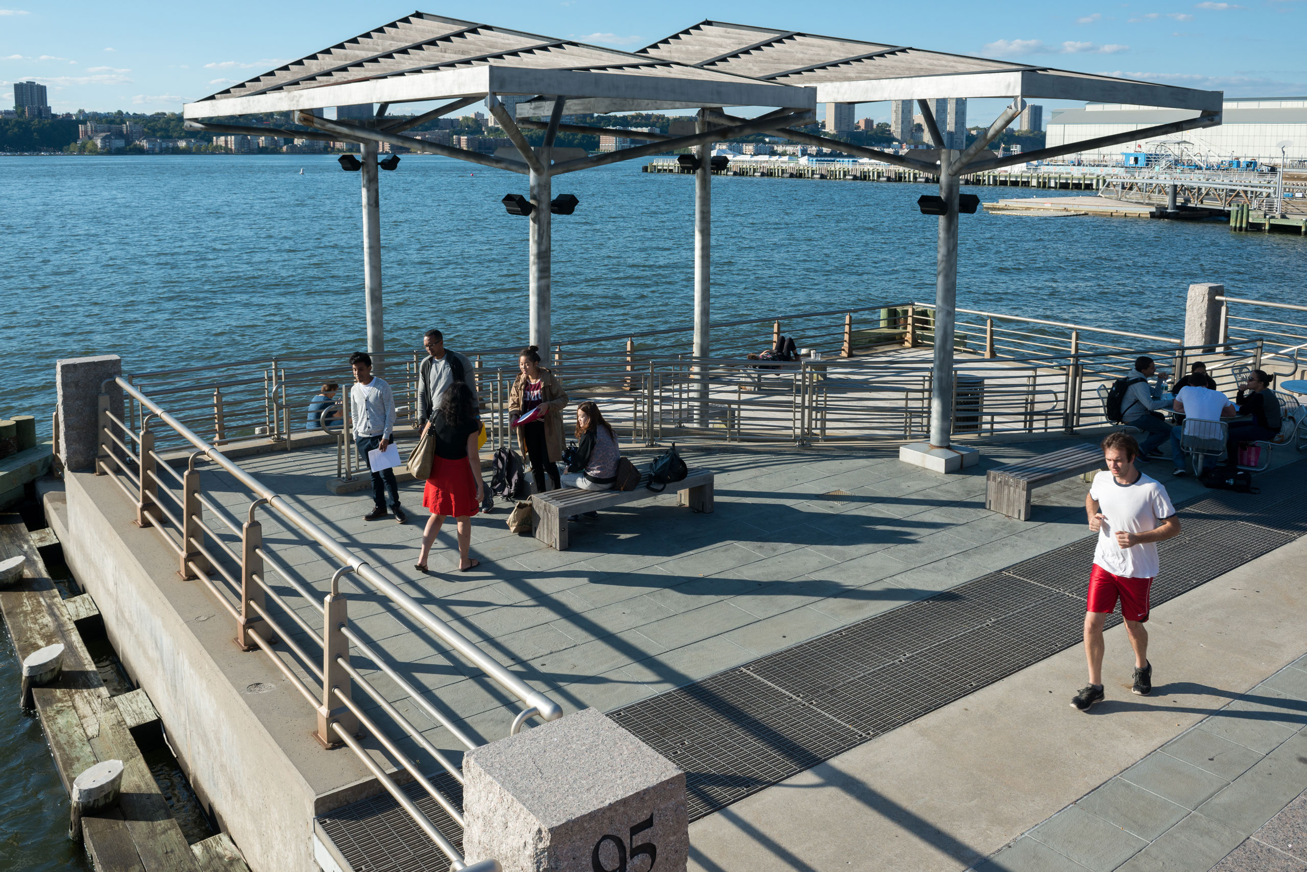 Park visitors and joggers on Pier 95 at Hudson River Park