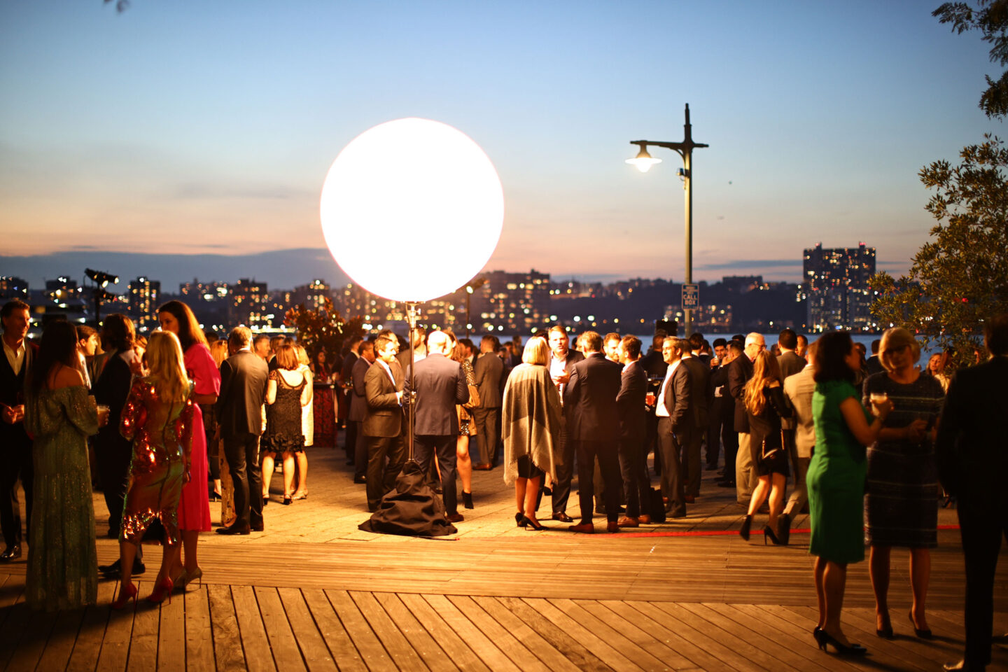 mingling-guests-at-2021-hrpk-gala-pier-62-sunset