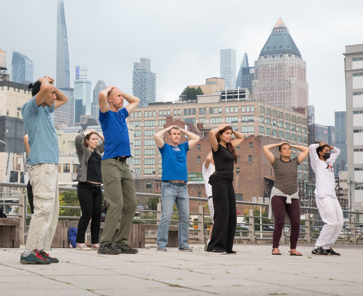 group of people doing tai chi at pier 84