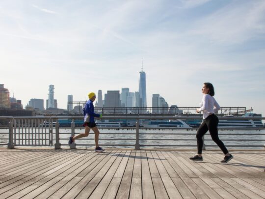 two people running on pier 45