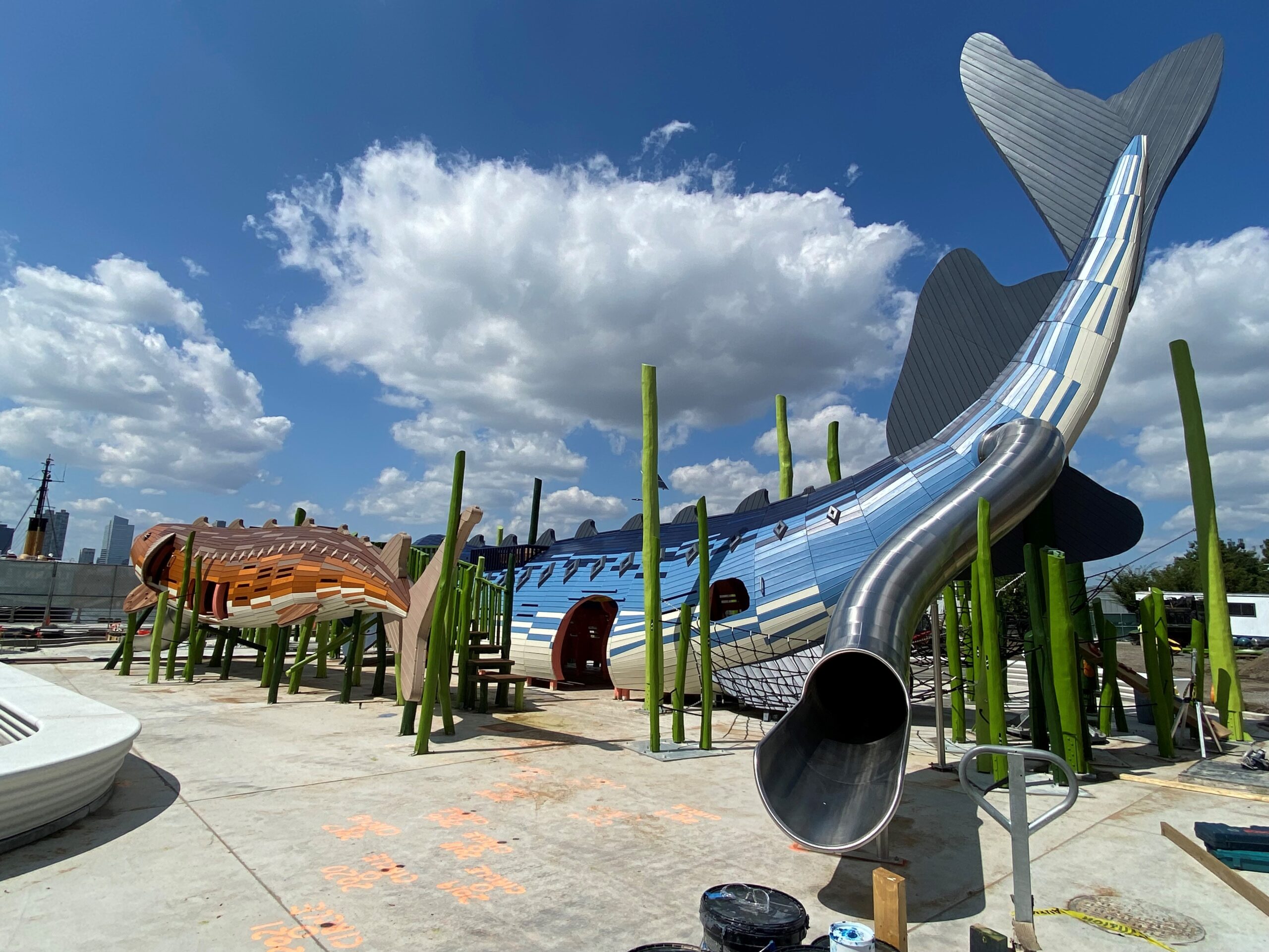 Playground slides designed to look like sturgeon under construction at the Pier 26 Science Play Area