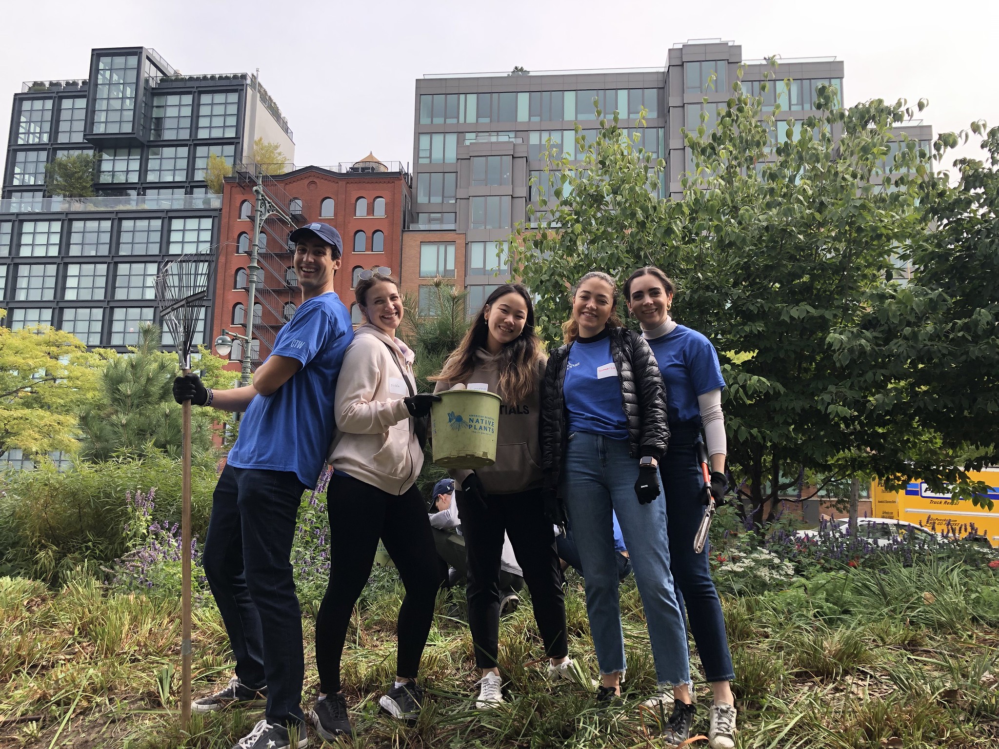 Volunteers pose with gardening supplies in Hudson River Park
