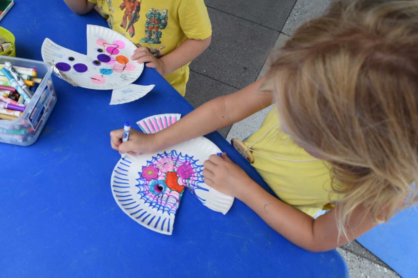 Two Sensory Science participants creating art with paper plates and markers