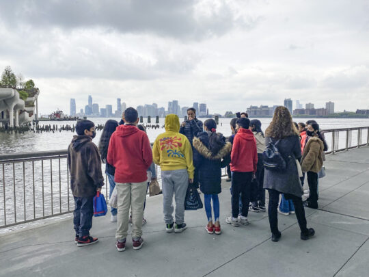 An HRPK River Project staffer speaks to a class of students during a walk along the Hudson River