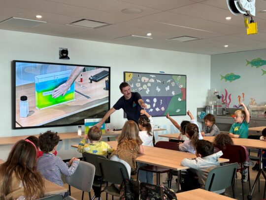An HRPK River Project staffer teaching a class full of students