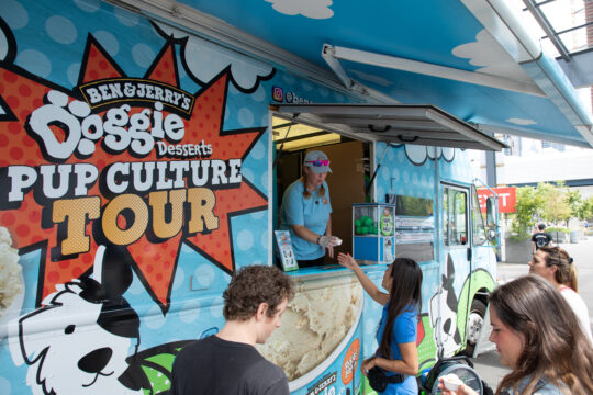 A truck with Ben and Jerry's dog treats hands out samples to attendees at Barkfest