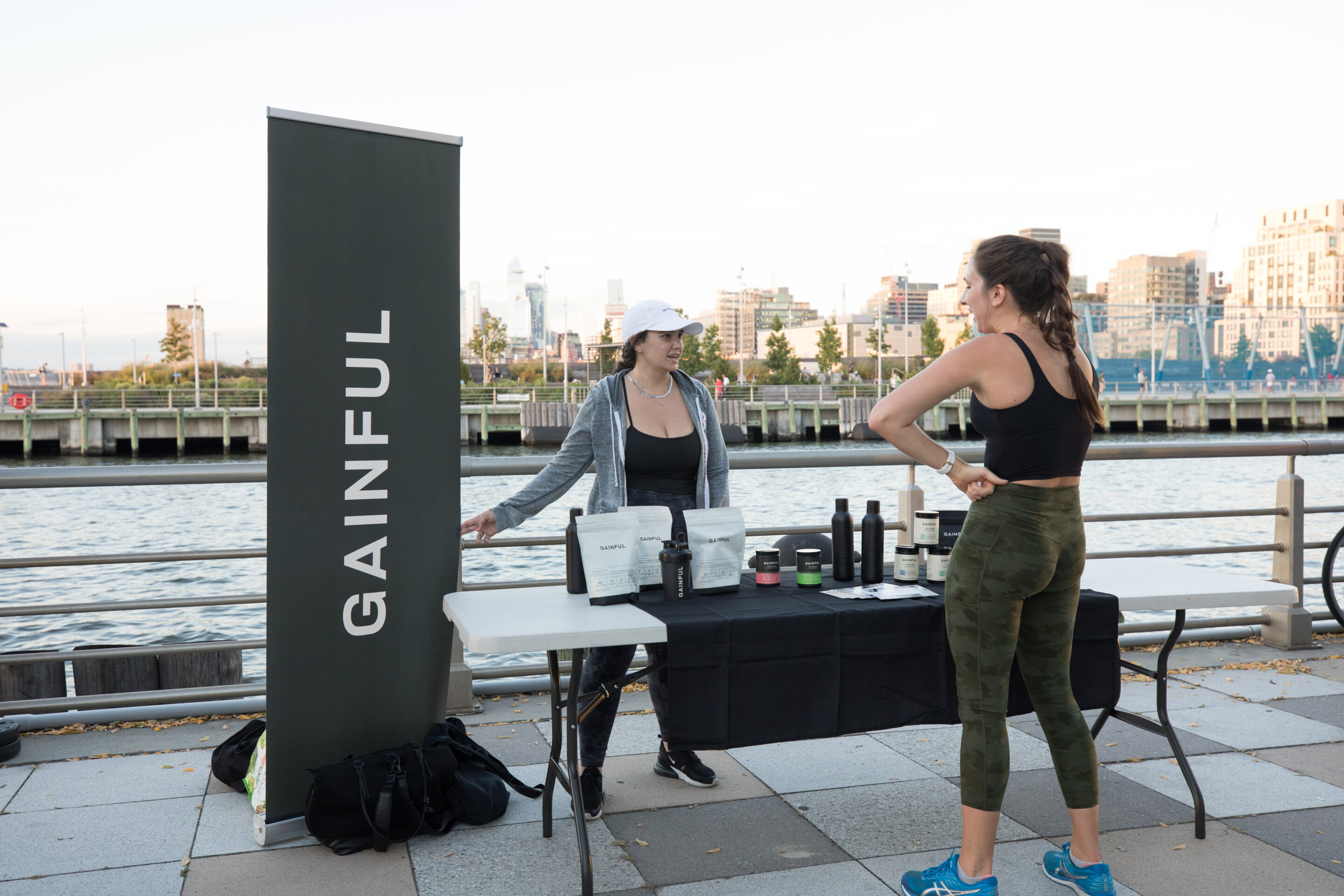 A brand representative from Gainful speaks with a Healthy on the Hudson class attendee