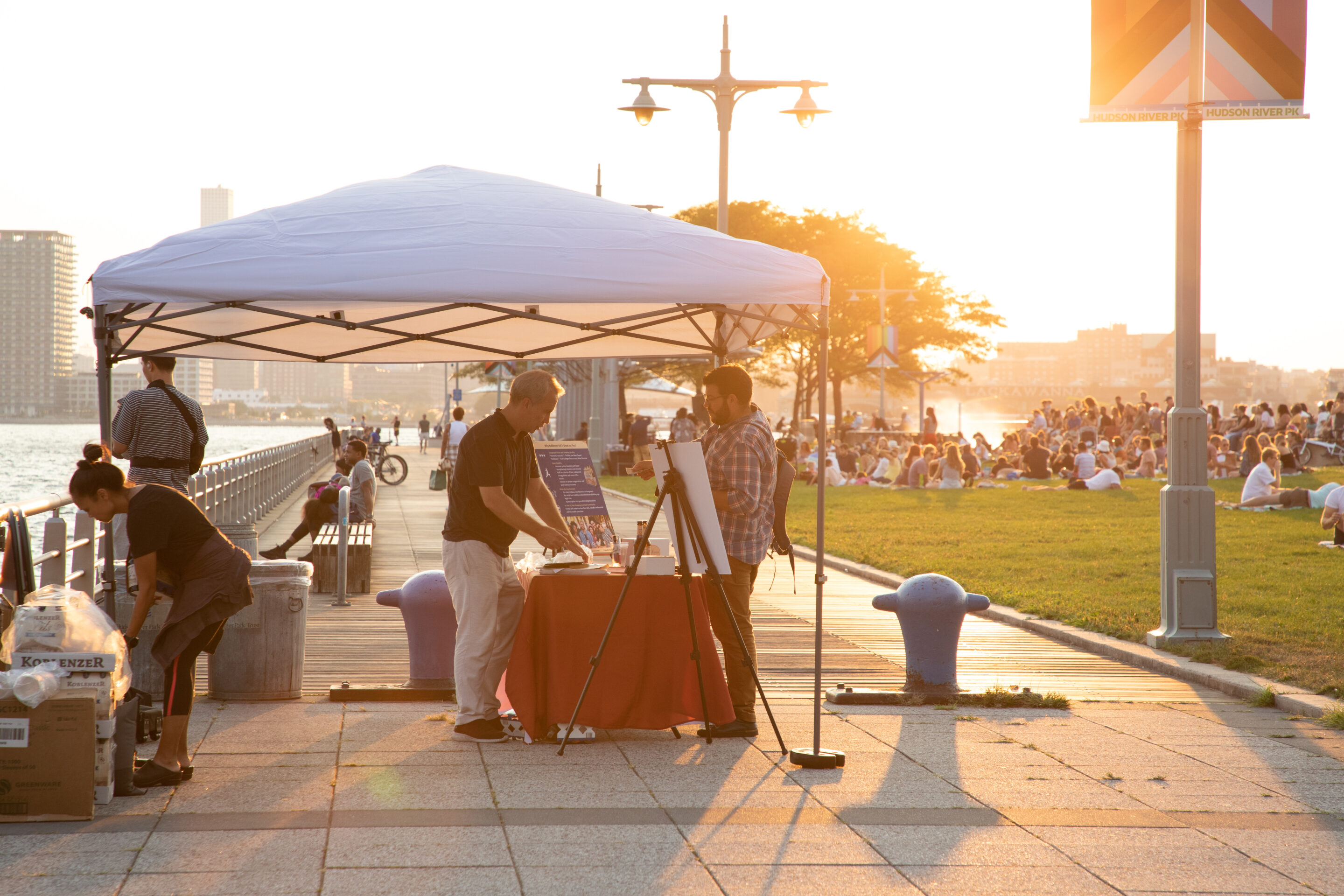 A vendor tent at a Sunset on the Hudson concert on Pier 45