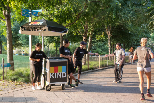 Brand representatives from KIND handing out samples near Pier 63