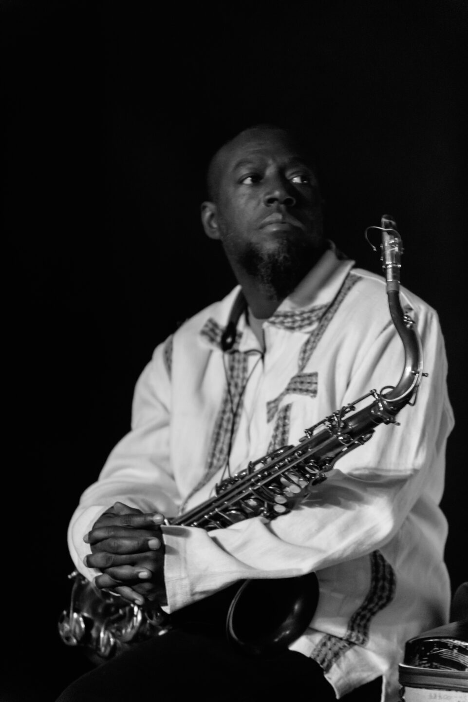 Antoine Roney holding a saxophone