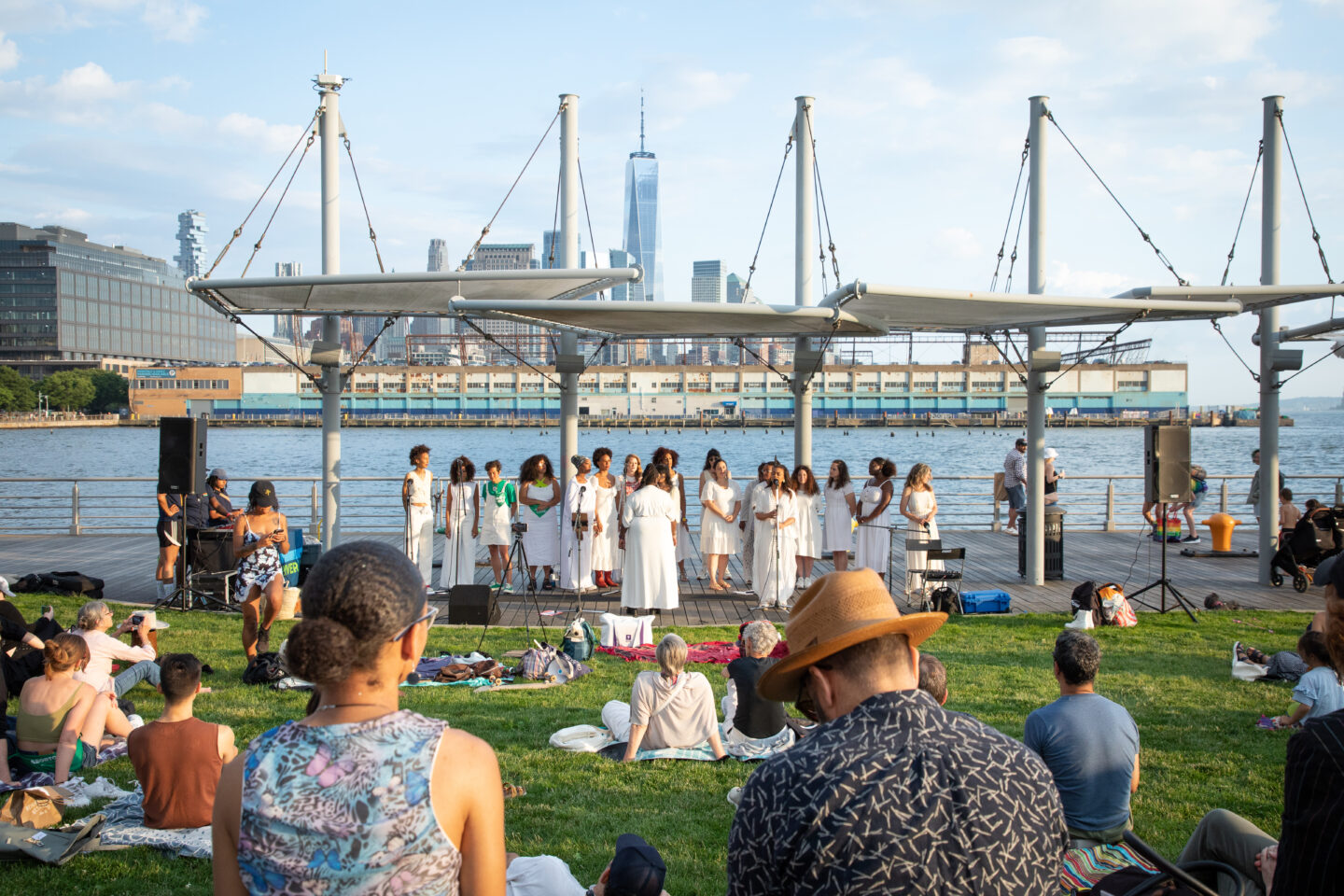 Resistance Revival Chorus performing on Pier 45 as part of a Sunset on the Hudson concert