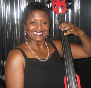 Kim Clarke standing with an upright bass
