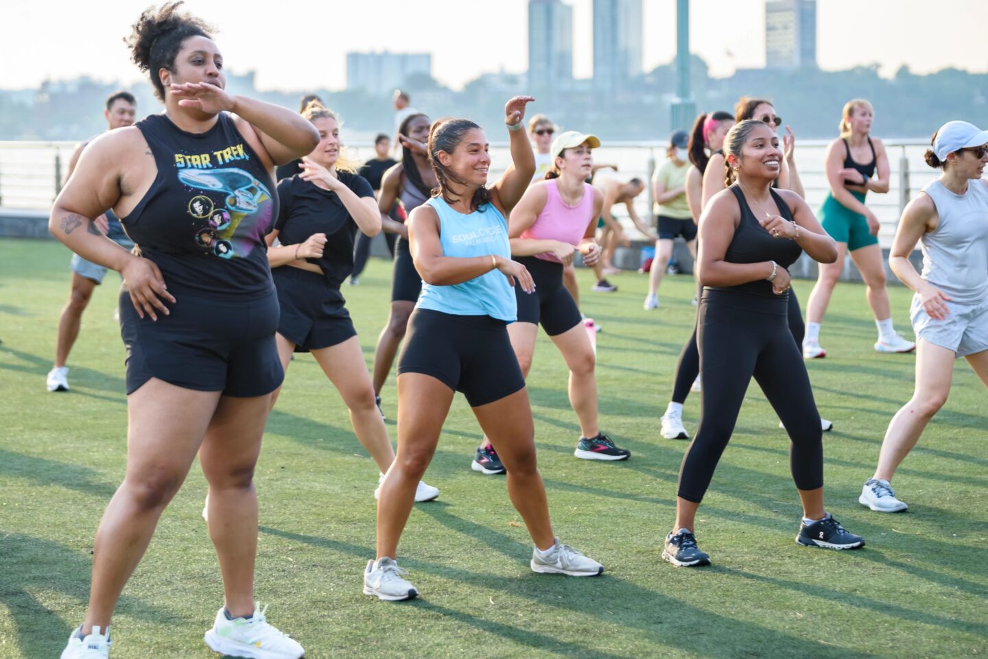 Healthy on the Hudson class participants move in sync during a class at Pier 46