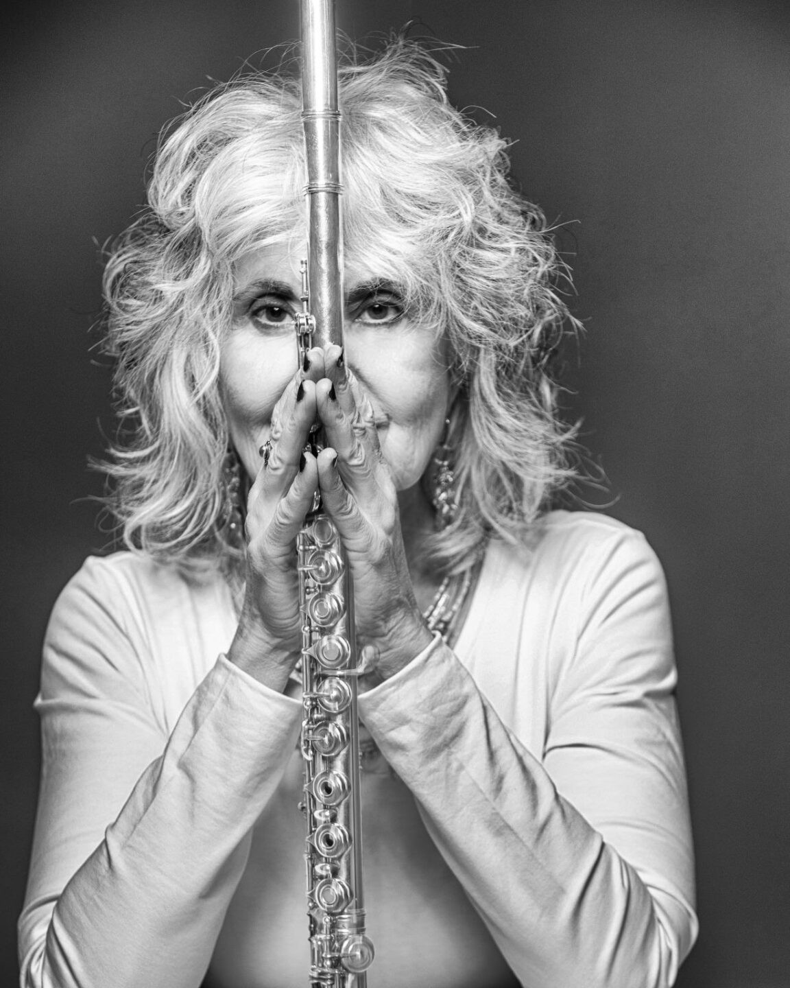 Headshot of Andrea Brachfeld holding a flute