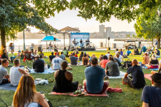 Park visitors enjoy a Broadway by the Boardwalk music performance from the lawn at Clinton Cove