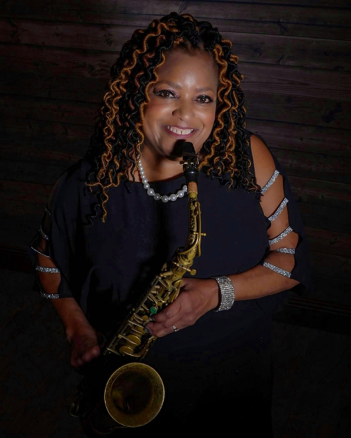 Fostina Dixon holding a saxophone