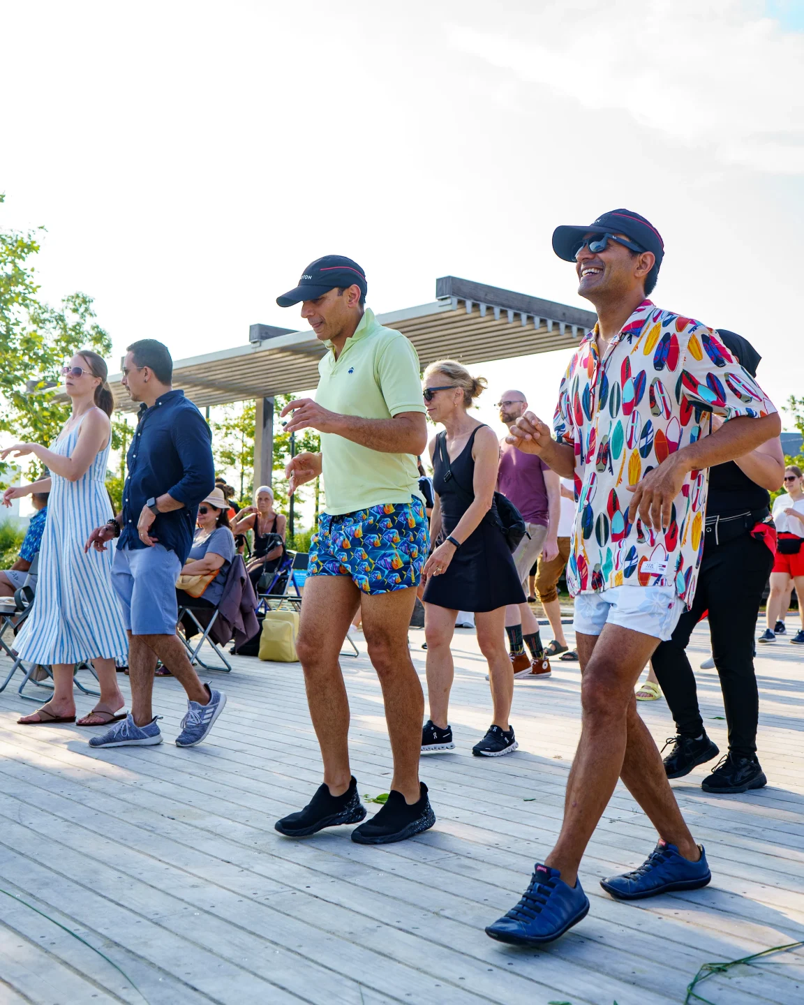 People dancing on the Gansevoort Peninsula boardwalk during a West Side Fest event
