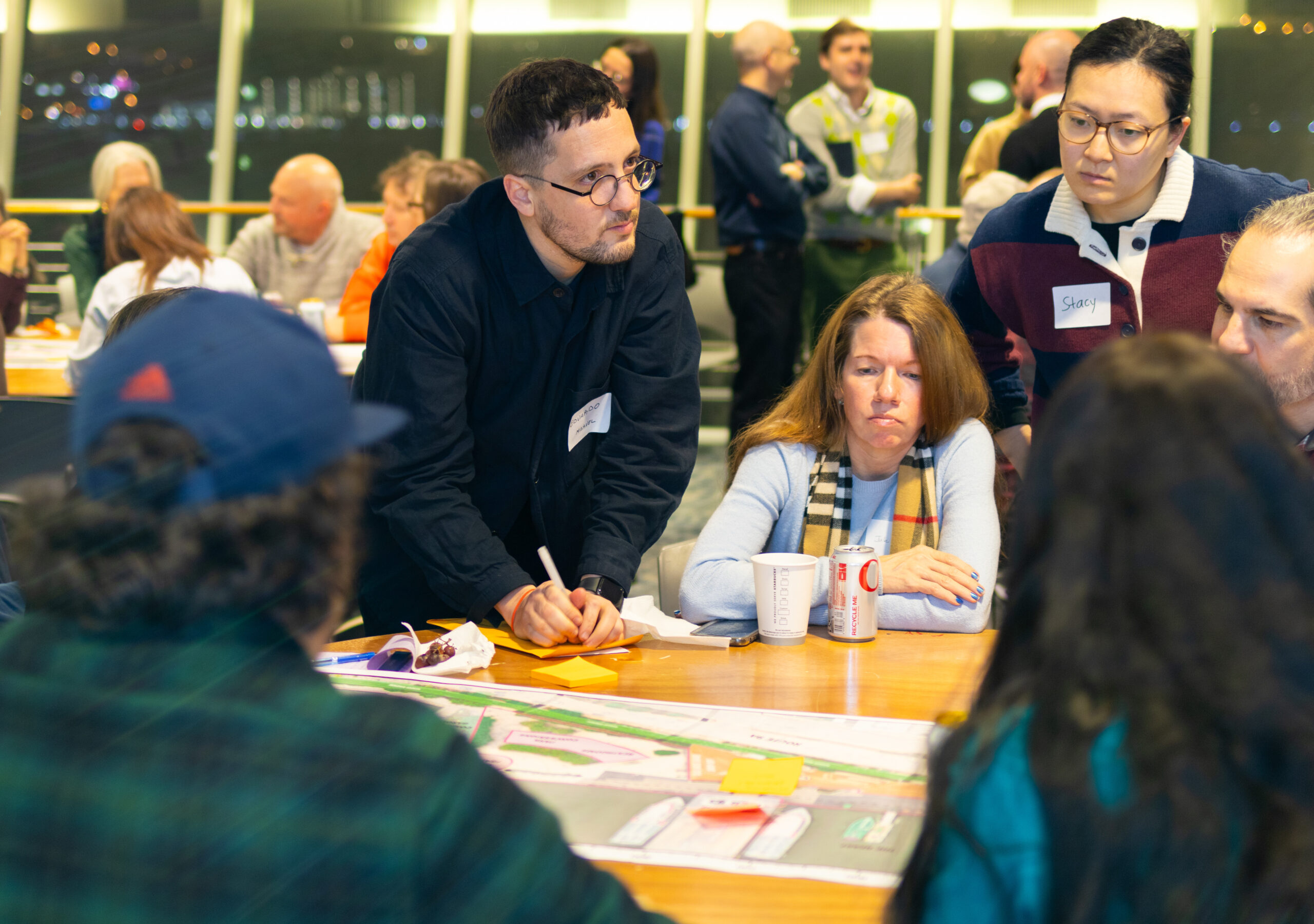 Members of the public in discussion during a W 29–W 44 Esplanade & Landscape Engagement Meeting at the Intrepid Museum