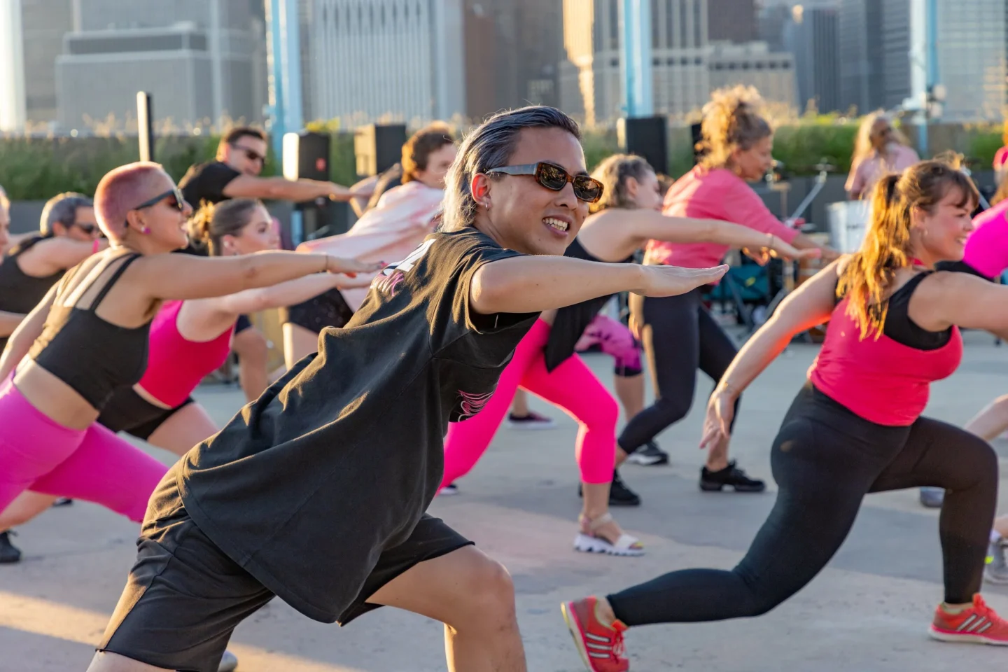 A dancer among a group of dancers at a Keigwin + Company outdoor event