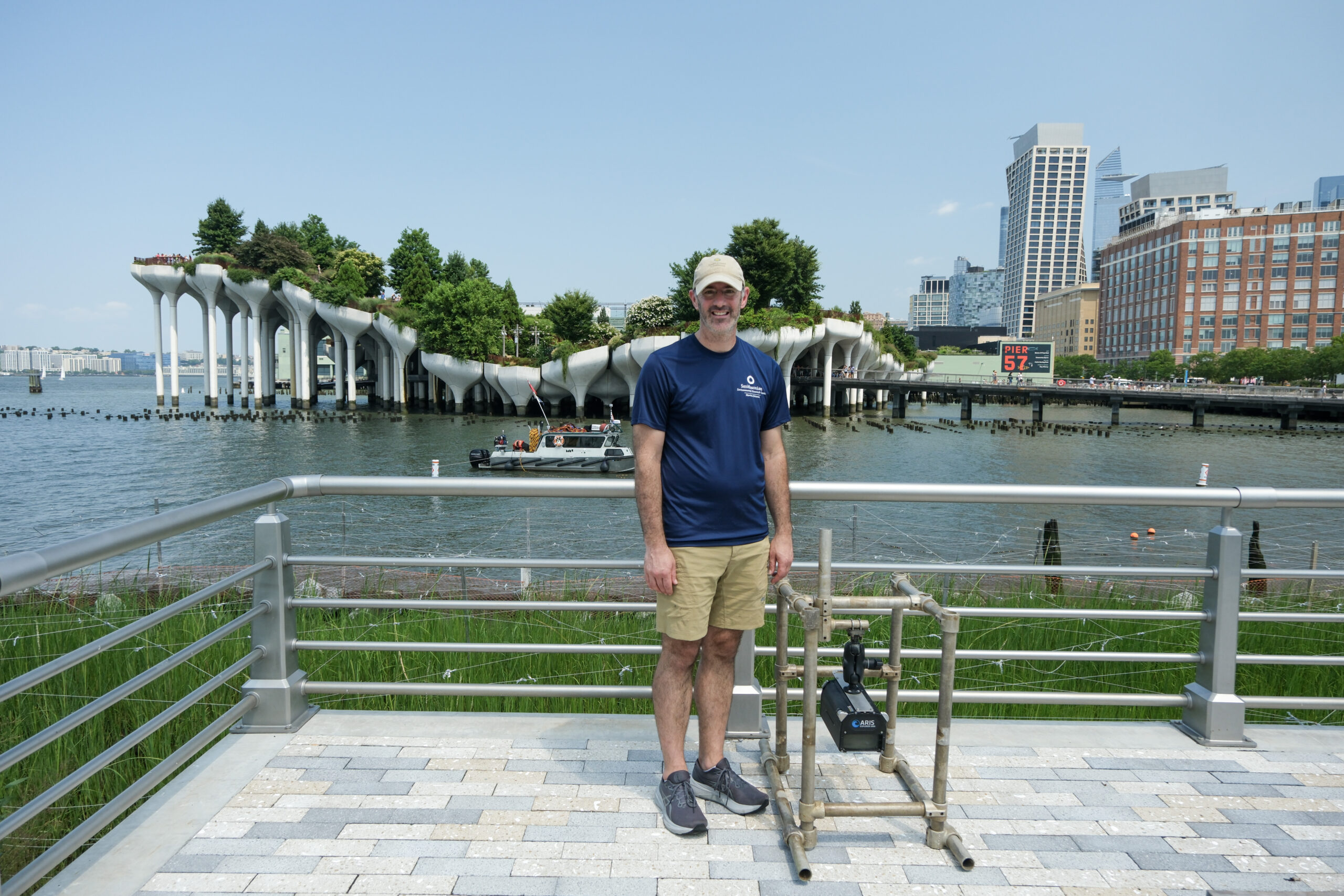 A researcher standing next to a recording device on Gansevoort Peninsula