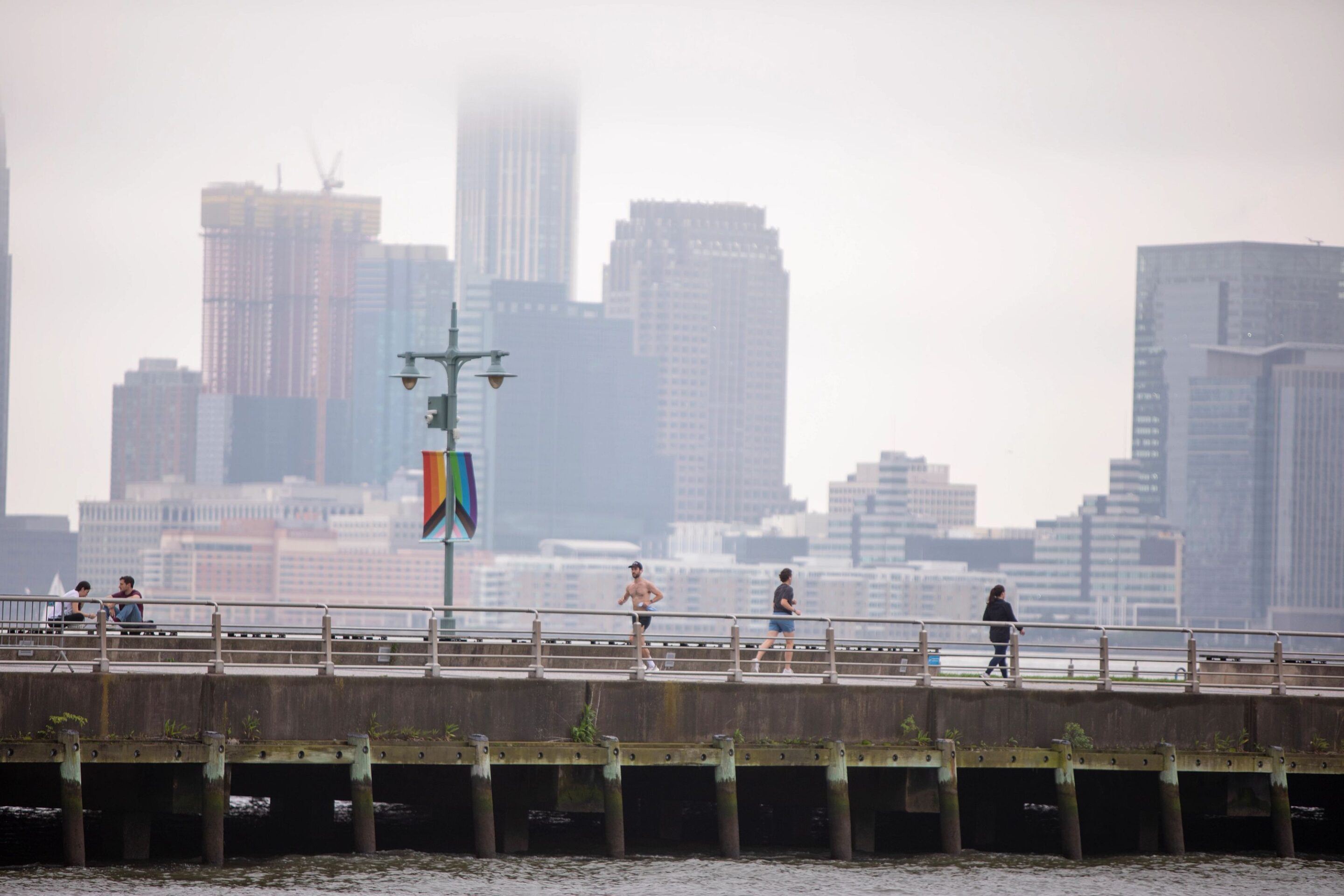 Runners and walkers on Pier 45 on a foggy day