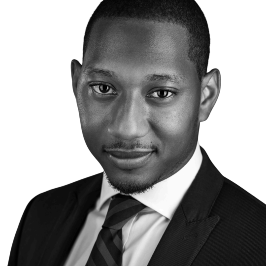 Professional headshot of Ian Belizaire